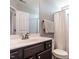 Bathroom with a large mirror, white countertops and a shower with curtain at 157 E Wilson St, Clayton, NC 27520