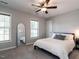 Bedroom with great natural light featuring neutral colors and a mirror at 157 E Wilson St, Clayton, NC 27520
