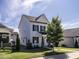 Attractive home with white siding, dark shutters, and a perfectly kept lawn at 157 E Wilson St, Clayton, NC 27520