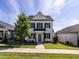 Charming two-story home with white siding, black shutters, and a well-manicured lawn at 157 E Wilson St, Clayton, NC 27520