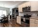 Cozy eat-in kitchen flows into the dining and living spaces, creating an open-concept feel at 157 E Wilson St, Clayton, NC 27520