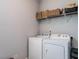 Functional laundry room with a washer and dryer ready for all your laundry needs at 157 E Wilson St, Clayton, NC 27520