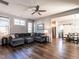 Spacious living room with a comfortable sectional sofa and adjacent dining area at 157 E Wilson St, Clayton, NC 27520