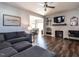 Open-concept living room flowing into the dining area, complete with a cozy fireplace at 157 E Wilson St, Clayton, NC 27520