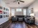 Living room featuring modern furniture, a sectional sofa, and stylish wall decor at 157 E Wilson St, Clayton, NC 27520