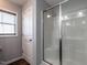 Bright shower with sliding glass doors and a window at 157 E Wilson St, Clayton, NC 27520