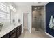 Modern bathroom features a double vanity, large shower, and tiled floor at 1604 Upper Park Rd, Wake Forest, NC 27587