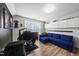 Bedroom featuring a couch, gaming set up, and hardwood floors at 1604 Upper Park Rd, Wake Forest, NC 27587