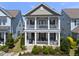 Charming two-story home with double porches and well-maintained landscaping at 1604 Upper Park Rd, Wake Forest, NC 27587