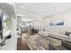 Bright, open-concept living room with hardwood floors and modern decor at 1604 Upper Park Rd, Wake Forest, NC 27587