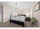 Comfortable main bedroom featuring a plush bed, elegant chandelier, and shutters for natural light at 1604 Upper Park Rd, Wake Forest, NC 27587