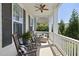 Inviting covered porch featuring rocking chairs and comfortable outdoor seating at 1604 Upper Park Rd, Wake Forest, NC 27587