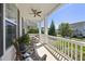 Inviting covered porch featuring rocking chairs and comfortable outdoor seating at 1604 Upper Park Rd, Wake Forest, NC 27587