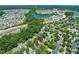 A beautiful home surrounded by lush greenery in a peaceful neighborhood with a nearby lake at 1617 Heritage Garden St, Wake Forest, NC 27587