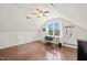 Bonus room with natural light, wood floors, and flexible layout for work or relaxation at 1617 Heritage Garden St, Wake Forest, NC 27587