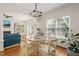 Dining room with hardwood floors, chandelier, and large windows at 1617 Heritage Garden St, Wake Forest, NC 27587