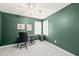 Serene home office with ample natural light from two windows, ideal for productivity at 1617 Heritage Garden St, Wake Forest, NC 27587