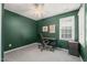 Comfortable home office with a cozy chair, desk, and natural light from the window at 1617 Heritage Garden St, Wake Forest, NC 27587