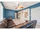 Living room with a leather couch and stylish built-in shelving providing ample storage space at 1617 Heritage Garden St, Wake Forest, NC 27587