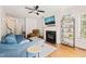 Bright living room with hardwood floors, fireplace, and a cozy seating area at 1617 Heritage Garden St, Wake Forest, NC 27587