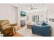 Cozy living room with fireplace, hardwood floors, and sliding door to the patio at 1617 Heritage Garden St, Wake Forest, NC 27587