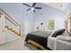 Main bedroom features high vaulted ceilings, a ceiling fan, and staircase to second floor at 1617 Heritage Garden St, Wake Forest, NC 27587