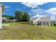 View of the backyard with grass and a wrought iron fence at 1745 Ripley Woods St, Wake Forest, NC 27587