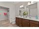 Stylish bathroom with double sinks, modern fixtures, and plenty of cabinet space, offering a luxurious and convenient experience at 1745 Ripley Woods St, Wake Forest, NC 27587