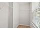 Clean and well-lit walk-in closet, enhanced by natural light and wire shelving at 1745 Ripley Woods St, Wake Forest, NC 27587