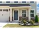 Close up of the home's front entrance, featuring a stylish door and stone accents at 1745 Ripley Woods St, Wake Forest, NC 27587