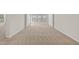 Expansive living room with neutral carpet and abundant natural light, providing a versatile space for any decor at 1745 Ripley Woods St, Wake Forest, NC 27587