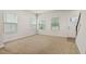Spacious living room with bright natural light from large windows and neutral decor at 1745 Ripley Woods St, Wake Forest, NC 27587