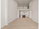Spacious living area featuring high ceilings, plush carpeting, and a view into the modern kitchen, perfect for relaxation at 1745 Ripley Woods St, Wake Forest, NC 27587