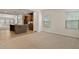 Open-concept living space featuring a view of the kitchen island and natural light at 1745 Ripley Woods St, Wake Forest, NC 27587