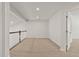 Neutral carpeted loft area with natural light and white doors at 1745 Ripley Woods St, Wake Forest, NC 27587