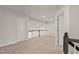 Neutral carpeted loft area with natural light from nearby windows and white doors at 1745 Ripley Woods St, Wake Forest, NC 27587