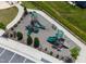 Aerial shot of a modern playground with slides, benches, and landscaping for Gathering enjoyment at 1745 Ripley Woods St, Wake Forest, NC 27587
