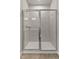 This bathroom features a glass enclosed shower with white tile and a double light fixture at 1745 Ripley Woods St, Wake Forest, NC 27587
