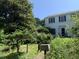 Charming two-story home with a mailbox and lush, mature landscaping at 1800 Avondale Dr, Durham, NC 27701