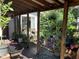 Cozy outdoor patio area with garden views and a wooden deck at 1800 Avondale Dr, Durham, NC 27701