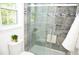 Updated bathroom with a tiled shower, glass door, and built-in niche at 1815 Chandellay Dr, Durham, NC 27705