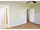 Spacious bedroom featuring wood floors, neutral walls, and a ceiling fan at 1815 Chandellay Dr, Durham, NC 27705