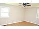 Neutral bedroom featuring hardwood floors, ceiling fan, and great natural light at 1815 Chandellay Dr, Durham, NC 27705