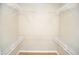 Walk-in closet with white shelving and ample storage space at 1815 Chandellay Dr, Durham, NC 27705