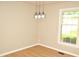 Bright dining room featuring hardwood floors and modern pendant lighting at 1815 Chandellay Dr, Durham, NC 27705