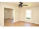 Bright living room featuring hardwood floors and a modern ceiling fan at 1815 Chandellay Dr, Durham, NC 27705