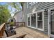Wood deck with table and chairs and a view of the back of the house at 1815 Crystal Downs Lane, Raleigh, NC 27604