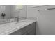 Bathroom vanity with granite countertops, modern faucet, and a decorative mirror at 1815 Crystal Downs Lane, Raleigh, NC 27604