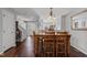 Inviting dining room with hardwood floors, view of the kitchen and access to front entry stairs at 1815 Crystal Downs Lane, Raleigh, NC 27604