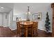 Dining room with wood table and chairs, hardwood floors, and view to the kitchen at 1815 Crystal Downs Lane, Raleigh, NC 27604